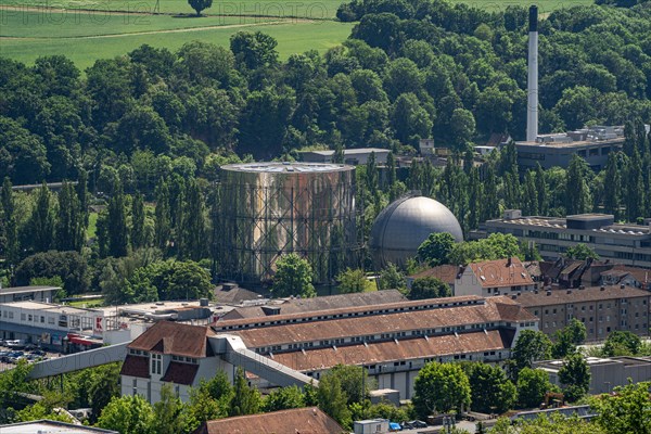 Industrial complex with cooling tower and factory buildings, surrounded by green spaces, gasometer, Pforzheim, Germany, Europe