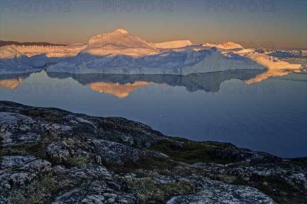 Reflection of icebergs, midnight sun, summer, Ilulissat Icefjord, Disko Bay, Jakobshavn Glacier, Greenland, North America
