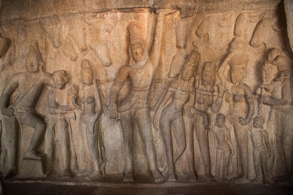 Shepherd god Krishna performs miracles and raises Mount GovardhanKrishna raises Mount Godhavaran, bas-relief, detail, UNESCO World Heritage Site, Mahabalipuram or Mamallapuram, Tamil Nadu, India, Asia