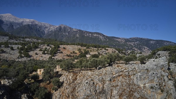 Ruins of old buildings against the majestic backdrop of a mountain, Aradena Gorge, Aradena, Sfakia, Crete, Greece, Europe