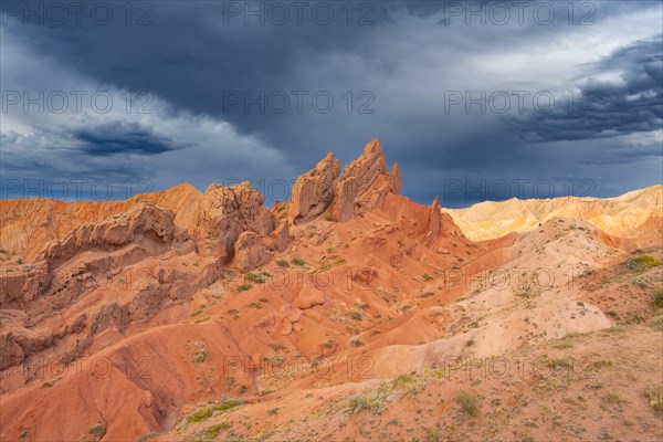 Eroded mountain landscape, sandstone cliffs, canyon with red and orange rock formations, Konorchek Canyon, Chuy, Kyrgyzstan, Asia