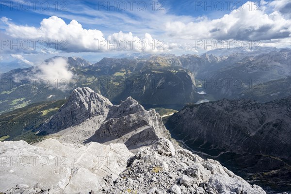 View from the rocky summit of the Watzmann Mittelspitze, view of mountain panorama with Steinernes Meer and Koenigssee, Kleiner Watzmann and Watzmann Kinder, Watzmann crossing, Berchtesgaden National Park, Berchtesgaden Alps, Bavaria, Germany, Europe