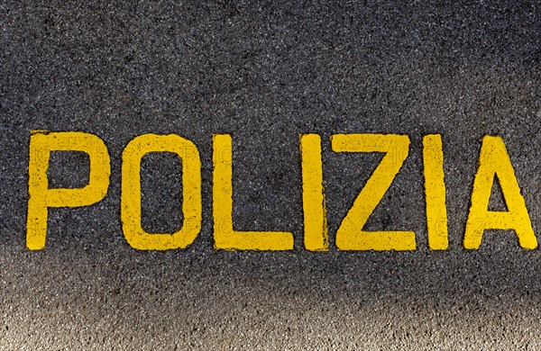 Police Written on the Asphalt Street in Italian Language in a Sunny Day in Lugano, Ticino, Switzerland, Europe