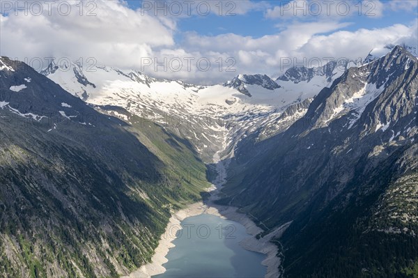 Picturesque mountain landscape near the Olpererhuette, view of turquoise-blue Schlegeisspeicher lake, glaciated rocky mountain peaks Grosser Moeseler, Hoher Weisszint and Hochfeiler with Schlegeiskees glacier, Berliner Hoehenweg, Zillertal Alps, Tyrol, Austria, Europe