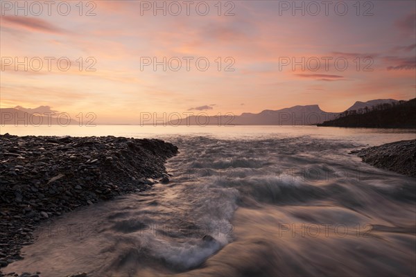 Sunrise at Lake Tornetraesk in Lapland. View of Abisko National Park and Laporten from Silverfallet