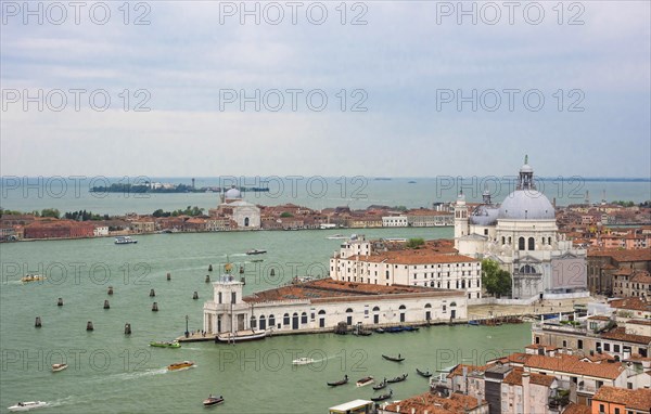 Panoramic aerial view of the Grand Canal with gondolas and boats and Basilica di Santa Maria della Salute in Venice, Italy, Europe