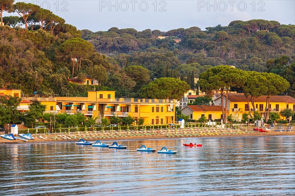 Pedal boats, sun loungers and parasols on the beach at Naregno at sunrise, near Capoliveri, Elba, Tuscan Archipelago, Tuscany, Italy, Europe