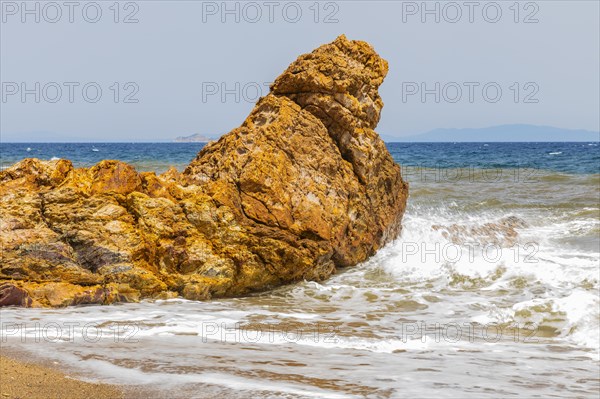 Mineral rock washed by the sea on the beach of Topinetti, near Rio Marina, Elba, Tuscan Archipelago, Tuscany, Italy, Europe