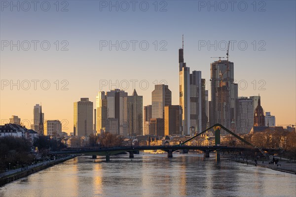 The light of the setting winter sun falls sideways onto the buildings of the Frankfurt banking skyline, Frankfurt am Main, Hesse, Germany, Europe