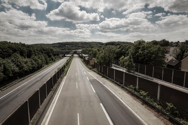View of an empty motorway bridge with railings, surrounded by trees under a cloudy sky, Sonnborner Kreuz, A46 motorway, Wuppertal Sonnborn, North Rhine-Westphalia, Germany, Europe