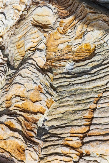 Coloured, ferruginous mineral sandstone on Topinetti beach, near Rio Marina, Elba, Tuscan Archipelago, Tuscany, Italy, Europe