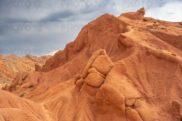 Eroded mountain landscape, sandstone cliffs, canyon with red and orange rock formations, Konorchek Canyon, Chuy, Kyrgyzstan, Asia