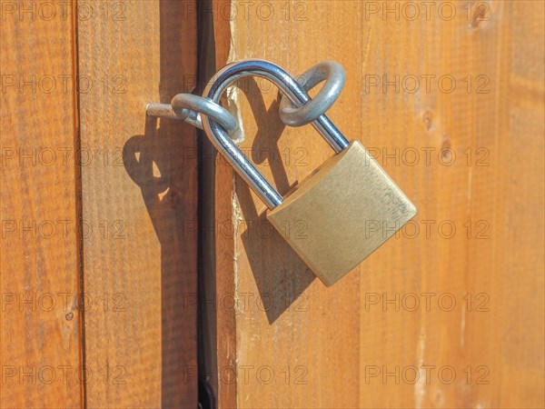 Padlock on a wood door