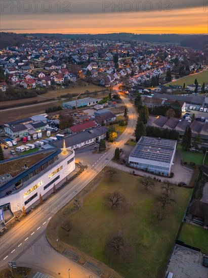 Aerial view of a cityscape with street lighting in the evening, Christmas tree on the roof, Black Forest, Gechingen, Germany, Europe