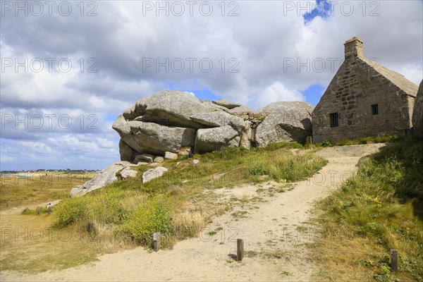 Former village of Meneham on the Atlantic coast with partly thatched houses between granite rocks, now an open-air museum, Menez Ham, Kerlouan, Finistere Penn ar Bed department, Brittany Breizh region, France, Europe