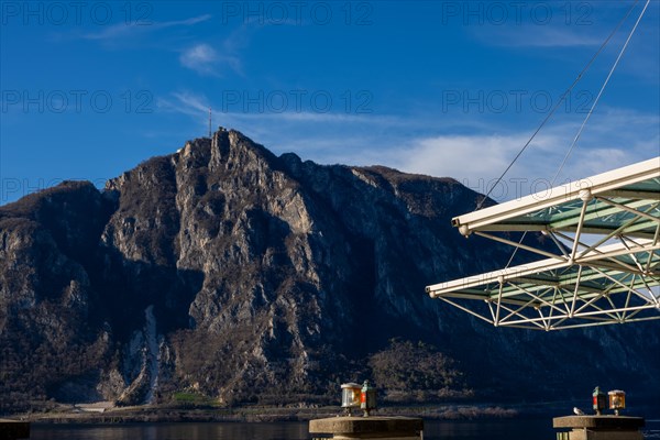 Modern Building Roof Against Blue Sky and Mountain Peak San Salvatore on Lake Lugano in Campione d'Italia, Lombardy, Italy, Europe