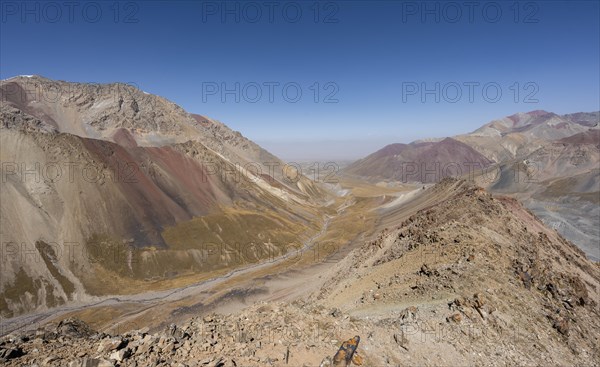 Mountain landscape of glacial moraines, mountains with red and yellow rocks, Traveller's Pass below Lenin Peak, Trans Alay Mountains, Pamir Mountains, Osh Province, Kyrgyzstan, Asia