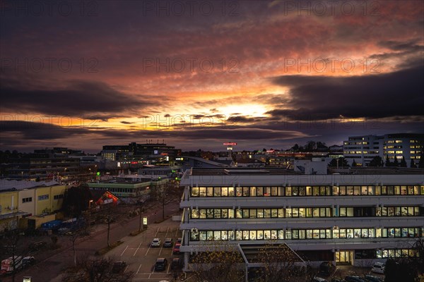 Dramatic sky on the Wilferdinger Hoehe at dusk over the city skyline with autumnal colours, Pforzheim, Germany, Europe