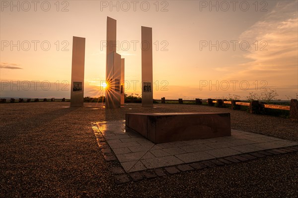 A monument catches the first rays of sunshine of the day, Pforzheim, Germany, Europe