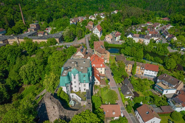 Drone view of a small town with green roofs and dense woodland, Pforzheim, Rabeneck Youth Hostel, Germany, Europe