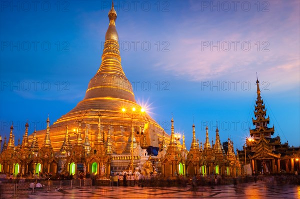 Myanmar famous sacred place and tourist attraction landmark, Shwedagon Paya pagoda illuminated in the evening. Yangon, Myanmar Burma