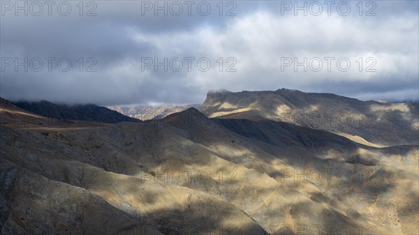 Low hanging clouds in the mountain landscape at the Tizi-n-Tichka pass road, High Atlas, Morocco, Africa