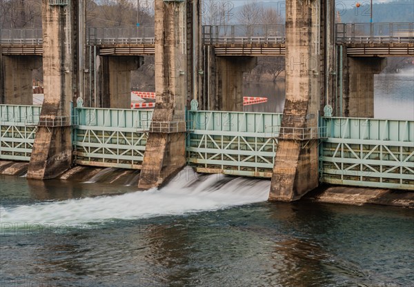 River dam in South Korea with water flowing through one of the flood gates