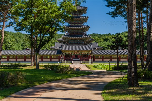 Buyeo, South Korea, July 7, 2018: Sidewalk leading to main gate of Neungsa Baekje Temple with five story pagoda, Asia