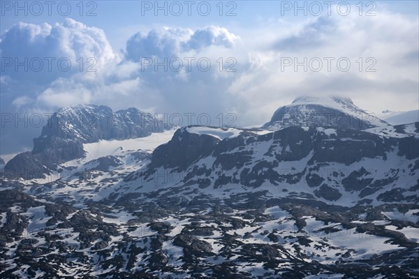 Amazing mountains panorama from 5 Fingers viewing platform in the shape of a hand with five fingers on Mount Krippenstein in the Dachstein Mountains of Upper Austria, Salzkammergut region, Austria, Europe