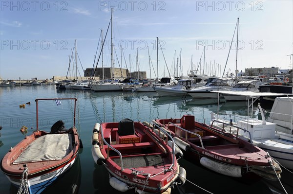 Fishing boats in the Venetian harbour of Heraklion, island of Crete, Greece, Europe