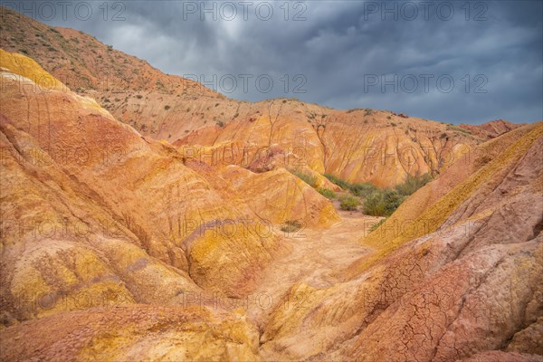 Eroded mountain landscape, sandstone cliffs, canyon with red and orange rock formations, Konorchek Canyon, Chuy, Kyrgyzstan, Asia