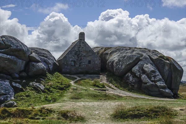 Former village of Meneham on the Atlantic coast with partly thatched houses between granite rocks, now an open-air museum, Menez Ham, Kerlouan, Finistere Penn ar Bed department, Brittany Breizh region, France, Europe