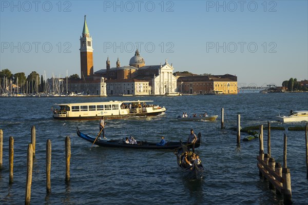 Gondolas on the promenade of the Riva degli Schiavon with a view of San Giorgia Maggiore, Venice, Veneto, Italy, Europe
