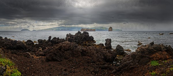 Panoramic view of the sea with the island of Faial and dramatic dark clouds, Madalena, Pico, Azores, Portugal, Europe