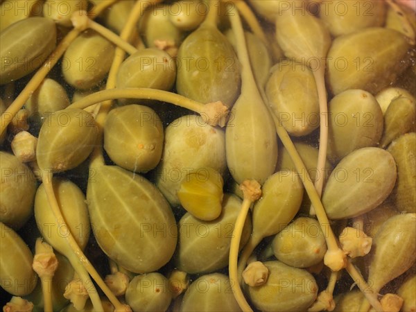 Pickled caper berries in glass jar