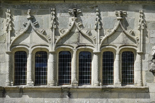 Window of the ossuary from the 16th century, Enclos Paroissial de Pleyben, Finistere department, Brittany region, France, Europe