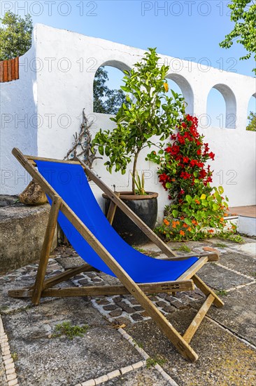 Blue deckchair on a terrace, Capoliveri, Elba, Tuscan Archipelago, Tuscany, Italy, Europe