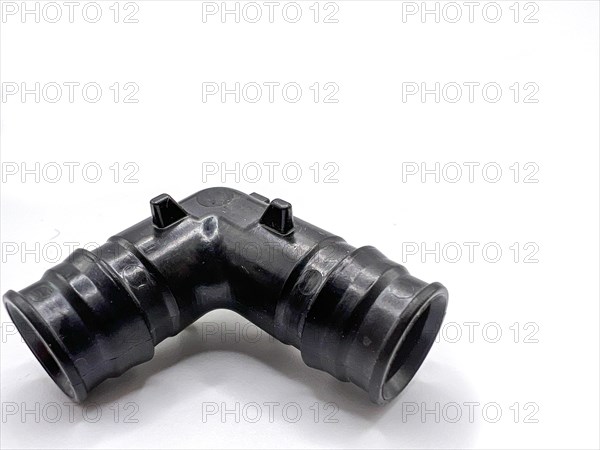 Black PVC pipe fittings isolated on white background. Black plastic water pipe. PVC accessories for plumbing. Plumber equipment. Bend and three way connection plastic pipe for water drain sewage