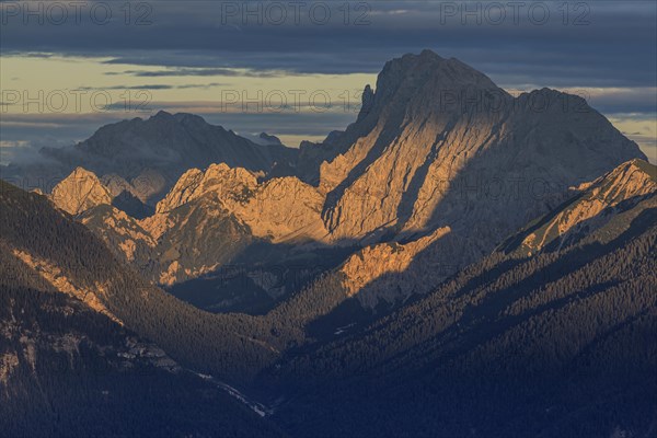 View over a valley to rugged mountains in the evening light, clouds, view from the Wank to the Karwendel mountains, Bavaria, Germany, Europe