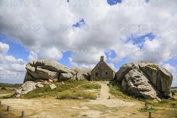 Former village of Meneham on the Atlantic coast with partly thatched houses between granite rocks, now an open-air museum, Menez Ham, Kerlouan, Finistere Penn ar Bed department, Brittany Breizh region, France, Europe