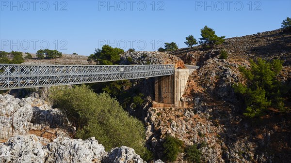 A bridge connects two rocky hills in a natural landscape, Aradena Gorge, Aradena, Sfakia, Crete, Greece, Europe