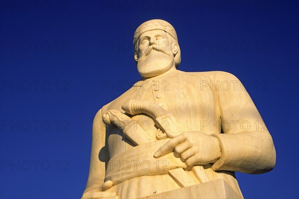 Statue of resistance fighter and partisan Yannis Daskaloyannis, A majestic statue of a historical figure stands out against a clear blue sky, Anopolis, Sfakia, West Crete, Crete, Greece, Europe
