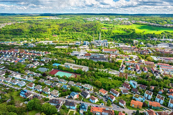 Aerial view of an urban landscape with residential areas, green spaces and a slightly cloudy sky, Pforzheim, Germany, Europe