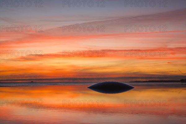 Fountain and pool near the Champalimaud foundation, Portuguese non-profit foundation for scientific medical research in Belem with sunset reflection