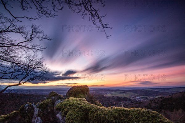 Landscape at the Grosser Zacken, Taunus volcanic region. A cloudy, sunny autumn day, meadows, hills, fields and forests with a view of the sunset. Hesse, Germany, Europe