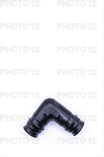 Plastic plumbing elbow. Elbow base Uponor plumbing tool