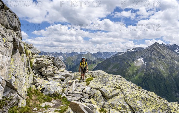 Mountaineer on hiking trail, Berliner Hoehenweg, mountain panorama with summit Grosser Ingent, Zillertal Alps, Tyrol, Austria, Europe