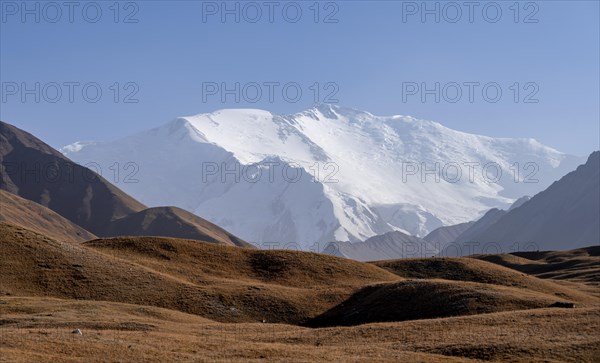 Mountains reflected in a small mountain lake, Pik Lenin, Trans Alay Mountains, Pamir Mountains, Osh Province, Kyrgyzstan, Asia