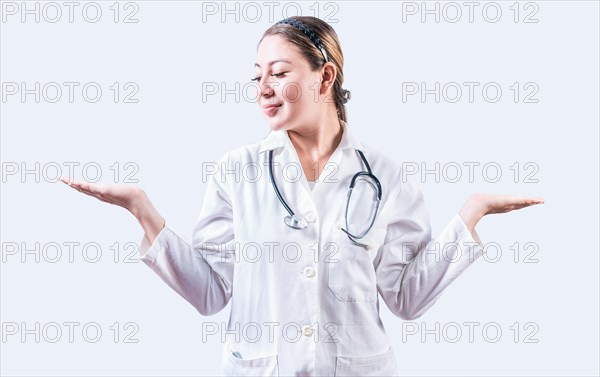 Female doctor presenting something with both palms. Young female doctor showing something with both palms isolated