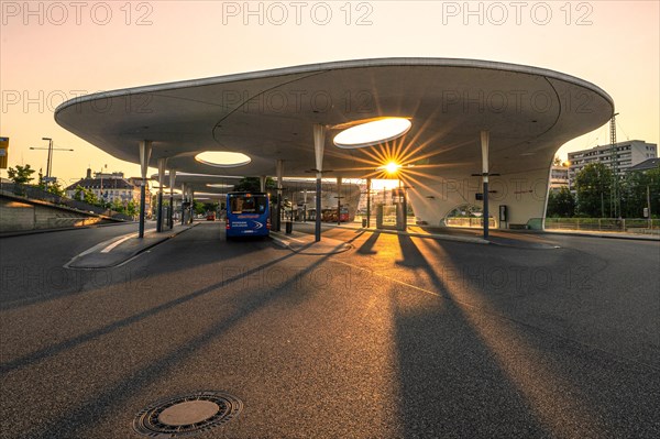 Sunset behind a futuristic-looking bus station, Pforzheim, Germany, Europe